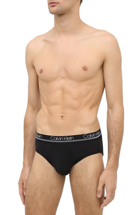 Мужские хлопковые брифы CALVIN KLEIN черного цвета по цене 3115 руб., арт. NB2176A | Фото 2 Мужские хлопковые брифы CALVIN KLEIN черного цвета, арт. NB2176A | Фото 2