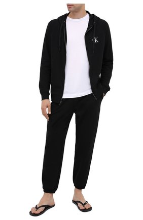 Мужские домашние джоггеры CALVIN KLEIN черного цвета по цене 6360 руб., арт. NM1866E | Фото 2 Мужские домашние джоггеры CALVIN KLEIN черного цвета, арт. NM1866E | Фото 2