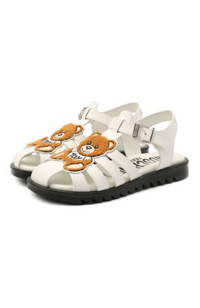 Детские кожаные босоножки MOSCHINO белого цвета по цене 31250 руб., арт. 65681/GUM/36-41 | Фото 1 Детские кожаные босоножки MOSCHINO белого цвета, арт. 65681/GUM/36-41 | Фото 1 (Материал внутренний: Натуральная кожа; Материал внешний: Кожа; Региональные ограничения белый список (Axapta Mercury): RU; Длина стельки: 24)