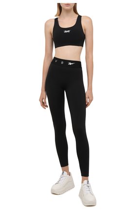 Женский бра-топ reebok x victoria beckham REEBOK черного цвета по цене 7915 руб., арт. H30228 | Фото 2 Женский бра-топ reebok x victoria beckham REEBOK черного цвета, арт. H30228 | Фото 2 (Материал подклада: Синтетический материал; Длина (для топов): Укороченные; Материал внешний: Синтетический материал; Стили: Спорт-шик; Женское Кросс-КТ: Топ-спорт)