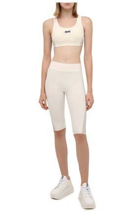 Женские шорты reebok x victoria beckham REEBOK молочного цвета по цене 7915 руб., арт. H30235 | Фото 2 Женские шорты reebok x victoria beckham REEBOK молочного цвета, арт. H30235 | Фото 2 (Длина Ж (юбки, платья, шорты): Миди; Материал внешний: Синтетический материал; Стили: Спорт-шик; Женское Кросс-КТ: Шорты-одежда, Шорты-спорт)