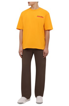 Мужские джинсы HERON PRESTON FOR CALVIN KLEIN коричневого цвета по цене 19750 руб., арт. K10K109179 | Фото 2 Мужские джинсы HERON PRESTON FOR CALVIN KLEIN коричневого цвета, арт. K10K109179 | Фото 2 (Материал внешний: Синтетический материал, Хлопок, Деним; Длина (брюки, джинсы): Стандартные; Кросс-КТ: Деним; Силуэт М (брюки): Широкие; Стили: Спорт-шик)