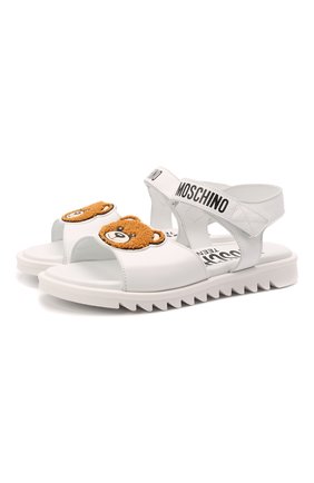 Детские кожаные сандалии MOSCHINO белого цвета по цене 26950 руб., арт. 70153/KIPS/36-41 | Фото 1 Детские кожаные сандалии MOSCHINO белого цвета, арт. 70153/KIPS/36-41 | Фото 1 (Материал внутренний: Натуральная кожа; Материал внешний: Кожа)