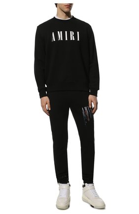Мужские хлопковые джоггеры AMIRI черного цвета по цене 89850 руб., арт. PS22MJL035-004 | Фото 2 Мужские хлопковые джоггеры AMIRI черного цвета, арт. PS22MJL035-004 | Фото 2 (Материал внешний: Хлопок; Длина (брюки, джинсы): Стандартные; Силуэт М (брюки): Джоггеры; Стили: Спорт-шик)